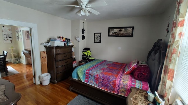 bedroom with wood finished floors and ceiling fan