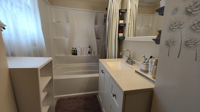 bathroom featuring shower / tub combo and vanity