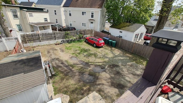 view of yard with fence and a residential view