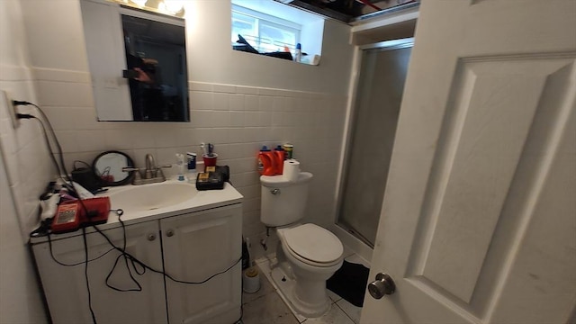 full bathroom featuring a stall shower, vanity, toilet, and tile patterned floors