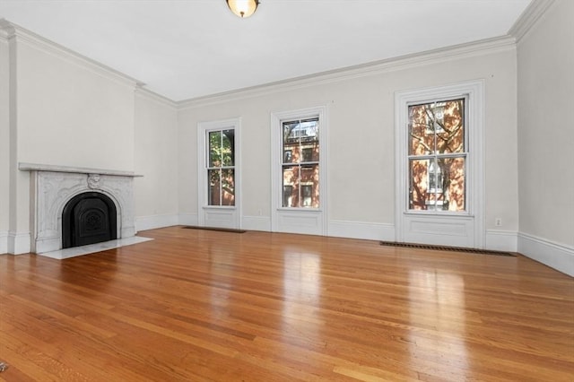43 Baldwin St, Boston, MA 02129 - unfurnished living room with wood finished floors, a fireplace with flush hearth, and ornamental molding