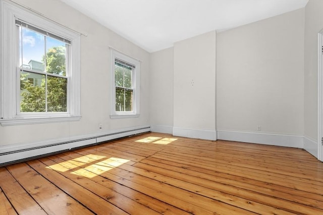 43 Baldwin St, Boston, MA 02129 - spare room featuring a baseboard heating unit and light wood-type flooring