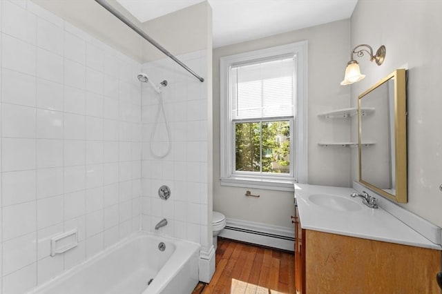 43 Baldwin St, Boston, MA 02129 - bathroom featuring a baseboard radiator, wood finished floors, vanity, and shower / bath combination