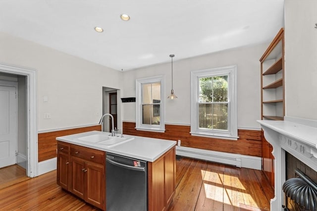 43 Baldwin St, Boston, MA 02129 - kitchen with stainless steel dishwasher, a baseboard heating unit, light wood-style floors, light countertops, and brown cabinetry