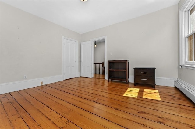 43 Baldwin St, Boston, MA 02129 - unfurnished room with wood-type flooring and a baseboard radiator