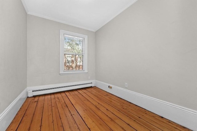 43 Baldwin St, Boston, MA 02129 - unfurnished room with a baseboard heating unit, ornamental molding, wood finished floors, and lofted ceiling