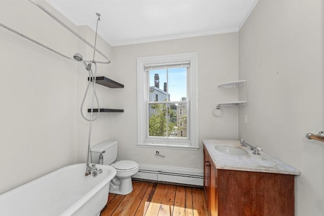 43 Baldwin St, Boston, MA 02129 - full bath featuring baseboard heating, a freestanding tub, wood finished floors, vanity, and ornamental molding