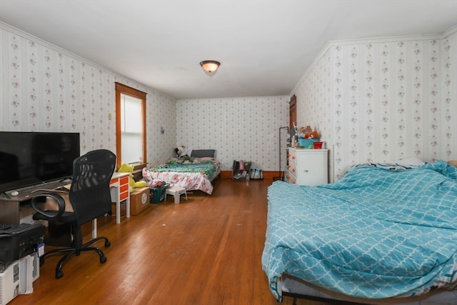 bedroom with hardwood / wood-style floors