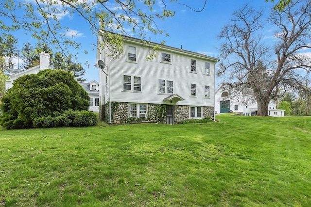 back of house with a yard