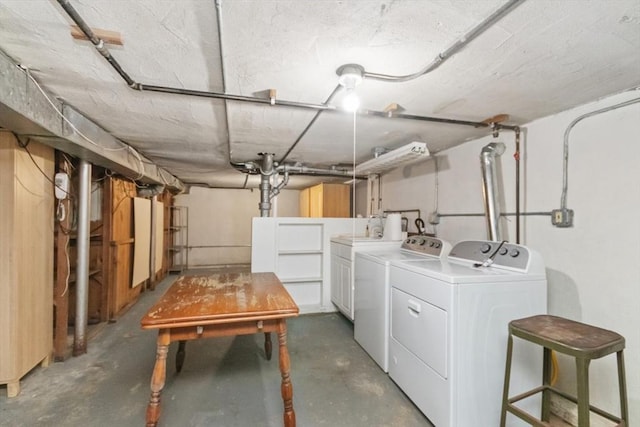 unfinished basement with washer and clothes dryer