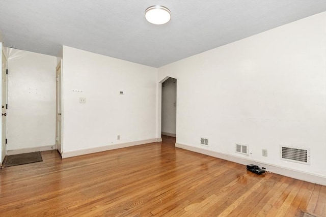 unfurnished room featuring light wood-style flooring and baseboards