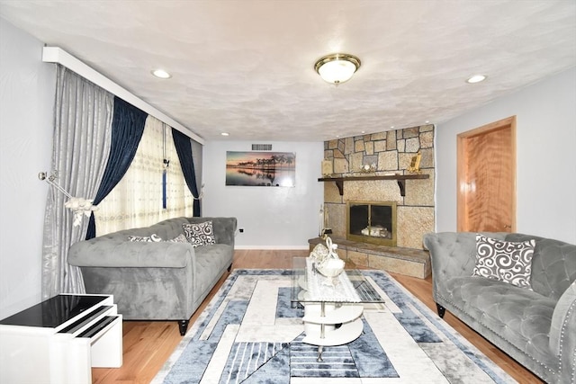 541 Grattan St, Chicopee, MA 01020 - living room featuring wood finished floors, recessed lighting, and a fireplace