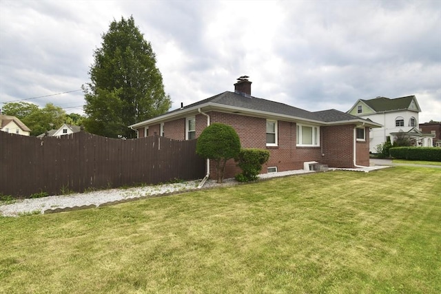 541 Grattan St, Chicopee, MA 01020 - back of house with brick siding and a chimney