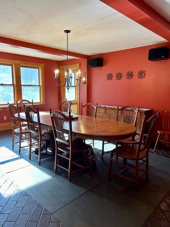 dining space with a notable chandelier