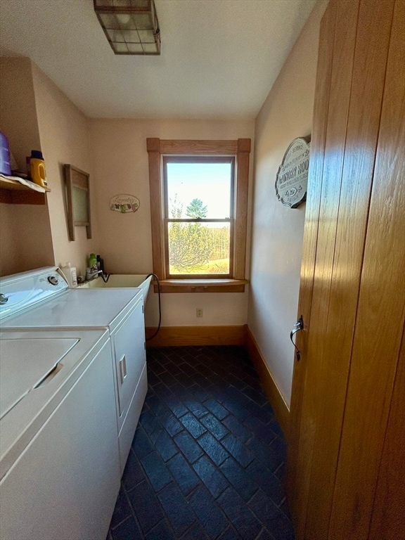 laundry area with washing machine and clothes dryer