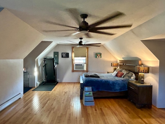 bedroom featuring baseboard heating, ceiling fan, light hardwood / wood-style flooring, and lofted ceiling