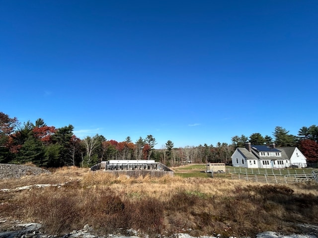 view of yard with a rural view