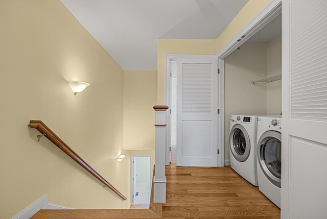 960 Main St Unit C, Woburn, MA 01801 - washroom featuring separate washer and dryer, light wood-style floors, and baseboards