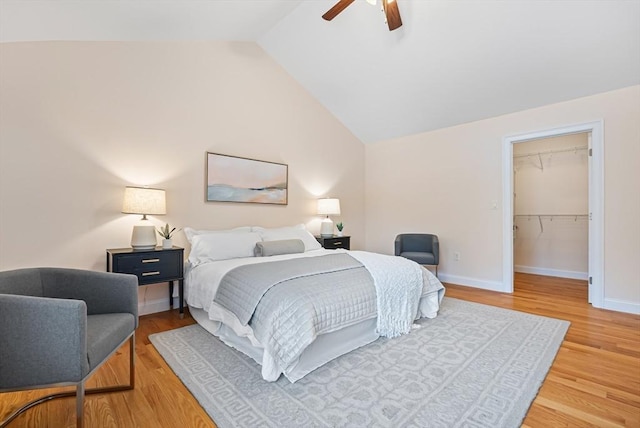 960 Main St Unit C, Woburn, MA 01801 - bedroom with wood finished floors, vaulted ceiling, baseboards, ceiling fan, and a walk in closet