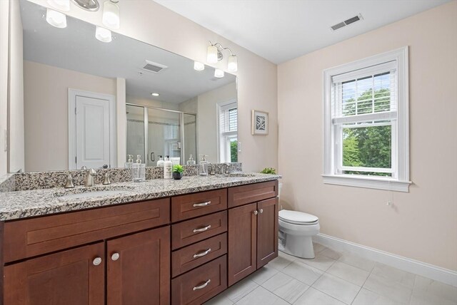960 Main St Unit C, Woburn, MA 01801 - full bath with double vanity, baseboards, a shower stall, and healthy amount of natural light