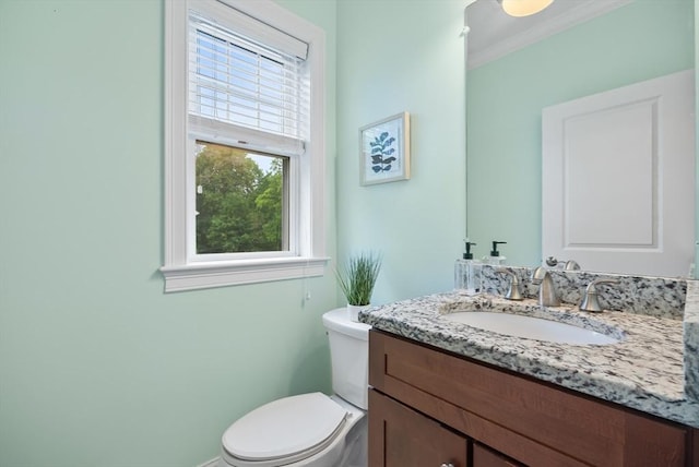960 Main St Unit C, Woburn, MA 01801 - bathroom featuring vanity, toilet, crown molding, and baseboards