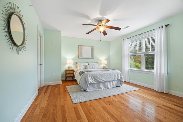 960 Main St Unit C, Woburn, MA 01801 - bedroom with baseboards, light wood-style floors, and ceiling fan