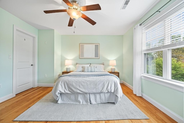960 Main St Unit C, Woburn, MA 01801 - bedroom featuring baseboards, light wood-type flooring, and a ceiling fan