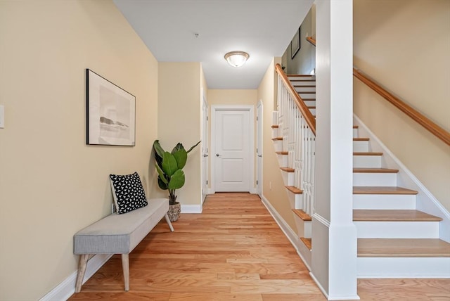 960 Main St Unit C, Woburn, MA 01801 - hallway featuring stairway, light wood-type flooring, and baseboards