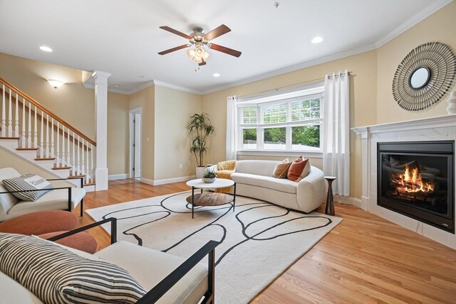 960 Main St Unit C, Woburn, MA 01801 - living area featuring wood finished floors, a ceiling fan, crown molding, decorative columns, and recessed lighting