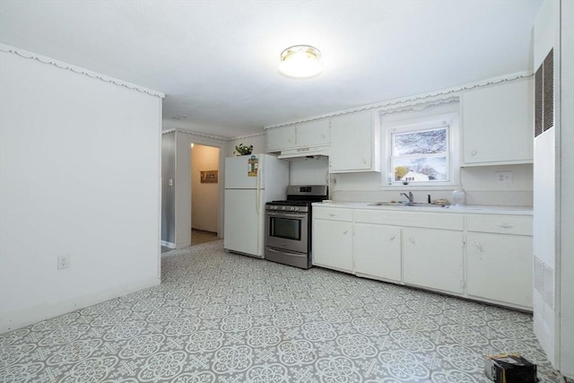 224-232 Caroline, New Bedford, MA 02740 - kitchen featuring stainless steel gas stove, freestanding refrigerator, light countertops, a sink, and white cabinets