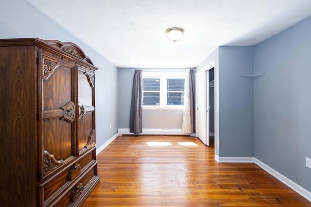 224-232 Caroline, New Bedford, MA 02740 - unfurnished bedroom with wood finished floors, baseboards, and a closet