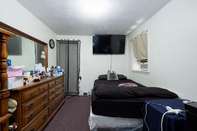 224-232 Caroline, New Bedford, MA 02740 - bedroom with dark carpet, a textured ceiling, and cooling unit