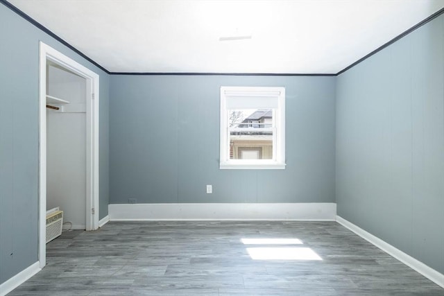 224-232 Caroline, New Bedford, MA 02740 - unfurnished bedroom with wood finished floors, baseboards, and crown molding