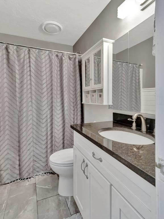 10 Vernon Ave, Hull, MA 02045 - bathroom featuring vanity, tile patterned floors, and a shower with curtain