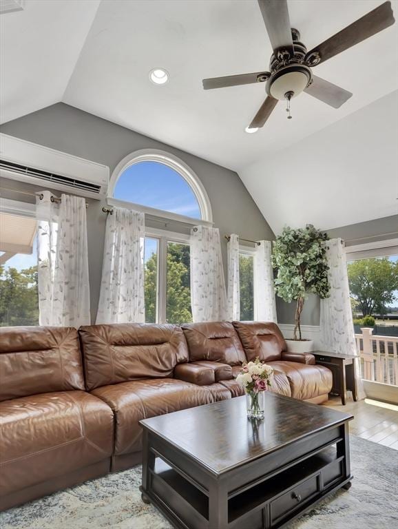 10 Vernon Ave, Hull, MA 02045 - living room featuring vaulted ceiling, healthy amount of natural light, a wall mounted air conditioner, recessed lighting, and light wood-style flooring
