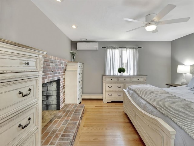 10 Vernon Ave, Hull, MA 02045 - bedroom featuring a wall mounted AC, a brick fireplace, a ceiling fan, and recessed lighting