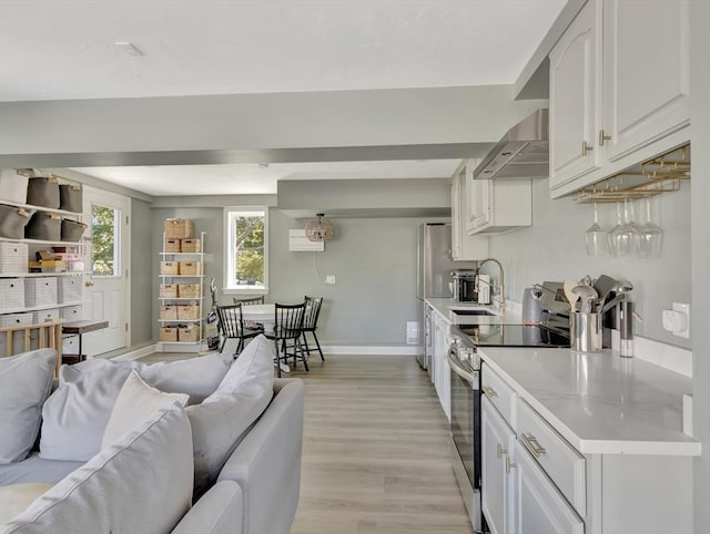 10 Vernon Ave, Hull, MA 02045 - living room with light wood-style floors and baseboards