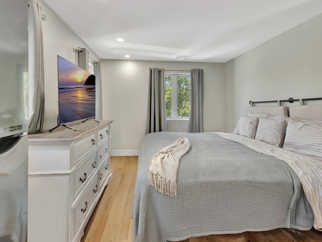 10 Vernon Ave, Hull, MA 02045 - bedroom with freestanding refrigerator, light wood finished floors, and recessed lighting