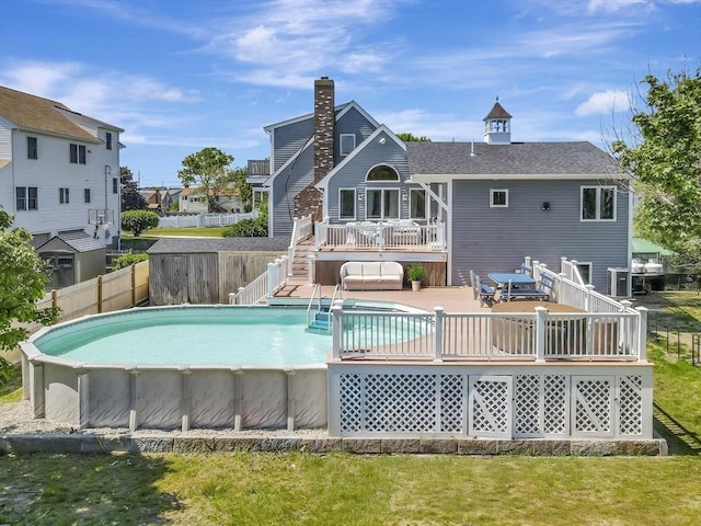 10 Vernon Ave, Hull, MA 02045 - rear view of house featuring a wooden deck, a fenced backyard, stairs, a chimney, and roof with shingles