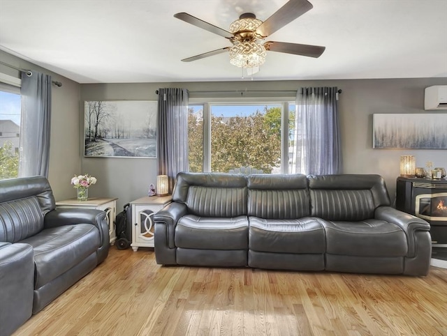 10 Vernon Ave, Hull, MA 02045 - living room with a ceiling fan, a wall mounted AC, and wood finished floors