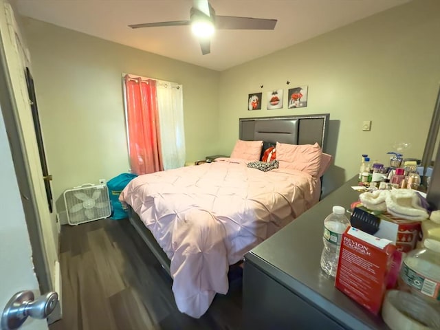 bedroom with ceiling fan and wood-type flooring