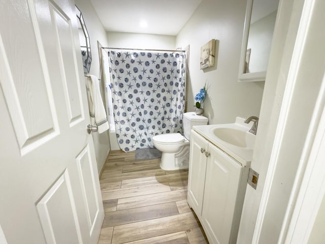 full bathroom featuring vanity, toilet, and shower / bath combo with shower curtain