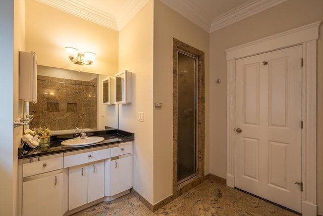 full bathroom with a shower stall, baseboards, crown molding, and vanity