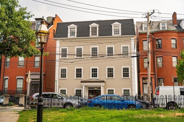 view of building exterior with fence