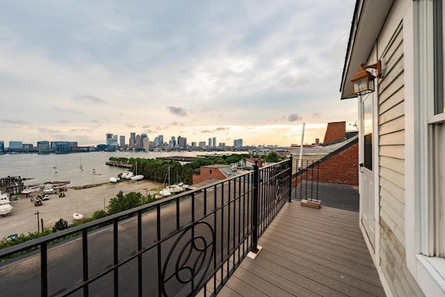 balcony with a view of city and a water view