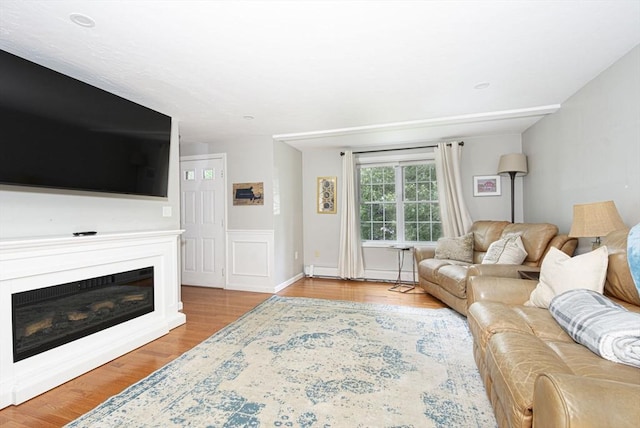 54 Clarke Rd, Sturbridge, MA 01518 - living room featuring wood finished floors and a glass covered fireplace
