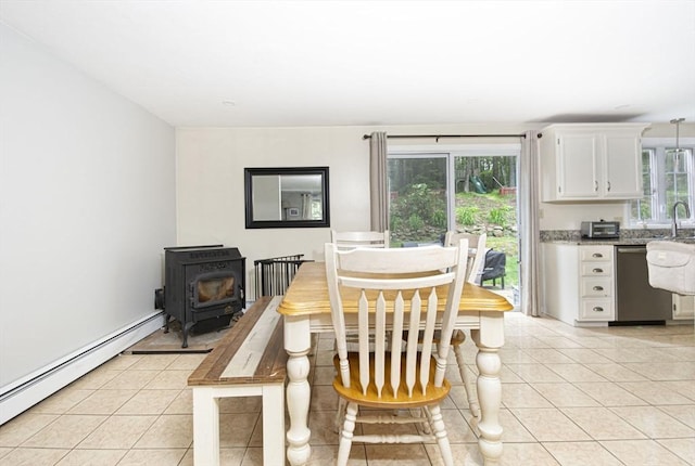 54 Clarke Rd, Sturbridge, MA 01518 - dining area featuring a baseboard radiator, light tile patterned floors, and healthy amount of natural light