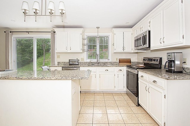 54 Clarke Rd, Sturbridge, MA 01518 - kitchen with stainless steel appliances, plenty of natural light, and white cabinetry