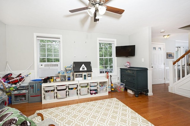 54 Clarke Rd, Sturbridge, MA 01518 - living area with plenty of natural light, stairway, a ceiling fan, and wood finished floors