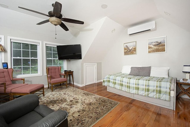 54 Clarke Rd, Sturbridge, MA 01518 - bedroom with an AC wall unit, lofted ceiling, wood finished floors, and a ceiling fan